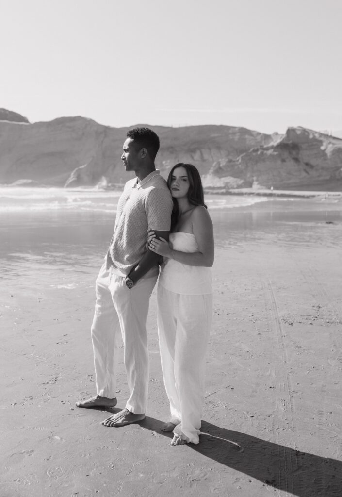 Romantic Cape Kiwanda couple by the ocean
Couple enjoying the sandy beach at Cape Kiwanda
Couple running along the beach at sunset
Coastal session with playful couple on the shore
Parents holding their baby boy on Oregon Coast
Sweet family moment by the ocean at Cape Kiwanda
Intimate family photography on the coastline
Dramatic cliffs along Cape Kiwanda shoreline
Sandstone rock formations on the Oregon Coast
Golden hour glow over Cape Kiwanda cliffs
Sunset glow over couple at Cape Kiwanda
Warm coastal light on the Oregon Coast
Natural candid moments during Cape Kiwanda session
Ocean breeze and laughter at the Oregon Coast
Cape Kiwanda sunset over the ocean