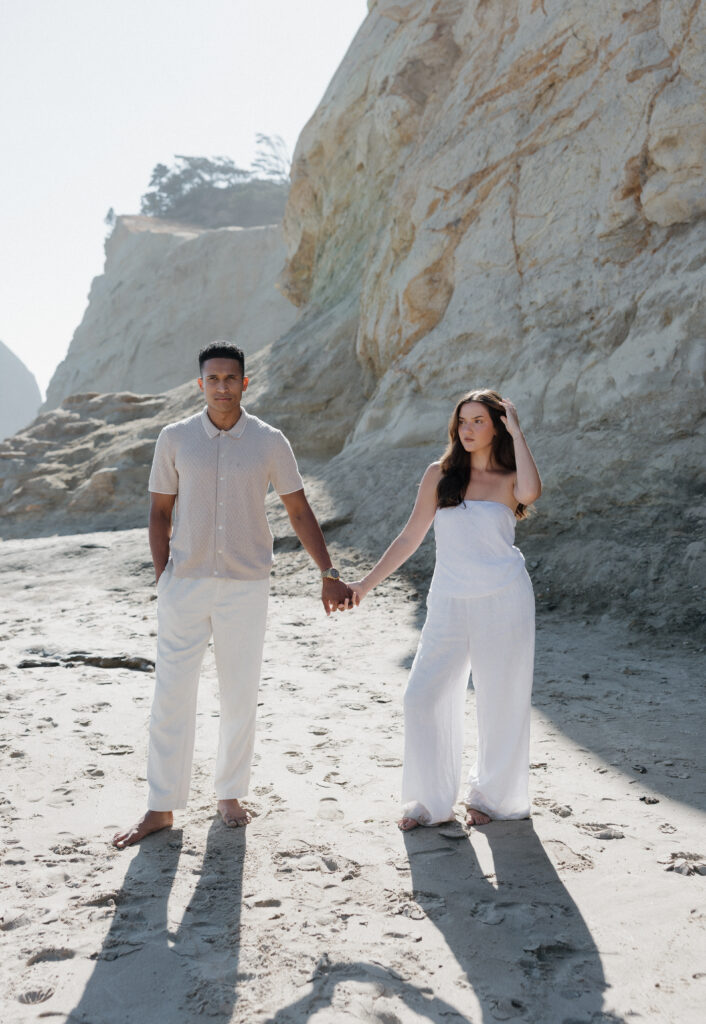 Romantic couple at Cape Kiwanda Oregon Coast
Couple laughing together on the sandy shoreline
Coastal couples session with wind-blown hair
Parents with baby boy at Cape Kiwanda
Tender family moment on the Oregon Coast
Intimate coastal family photography
Dramatic cliffs at Cape Kiwanda
Sandstone formations along the Oregon Coast
Golden hour light over Cape Kiwanda coastline
Couple running playfully on the beach
Natural movement during Cape Kiwanda session
Ocean breeze and laughter on the Oregon Coast
Sunset couples session at Cape Kiwanda
Warm golden hour glow on the Oregon Coast
Cape Kiwanda coastal sunset photography