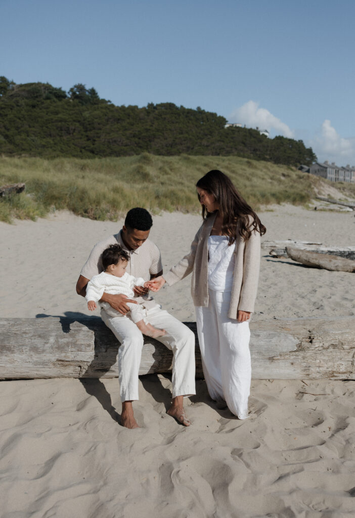 Parents holding their baby boy on Oregon Coast
Sweet family moment by the ocean at Cape Kiwanda
Intimate family photography on the coastline
Couple with their child on the sandy beach
Coastal family session at Cape Kiwanda
Family cuddles during Cape Kiwanda photo session
Baby boy with parents at sunset on Oregon Coast
Tender family moments by the ocean cliffs
Oregon Coast family love captured at Cape Kiwanda
Playful family time on the beach at Cape Kiwanda