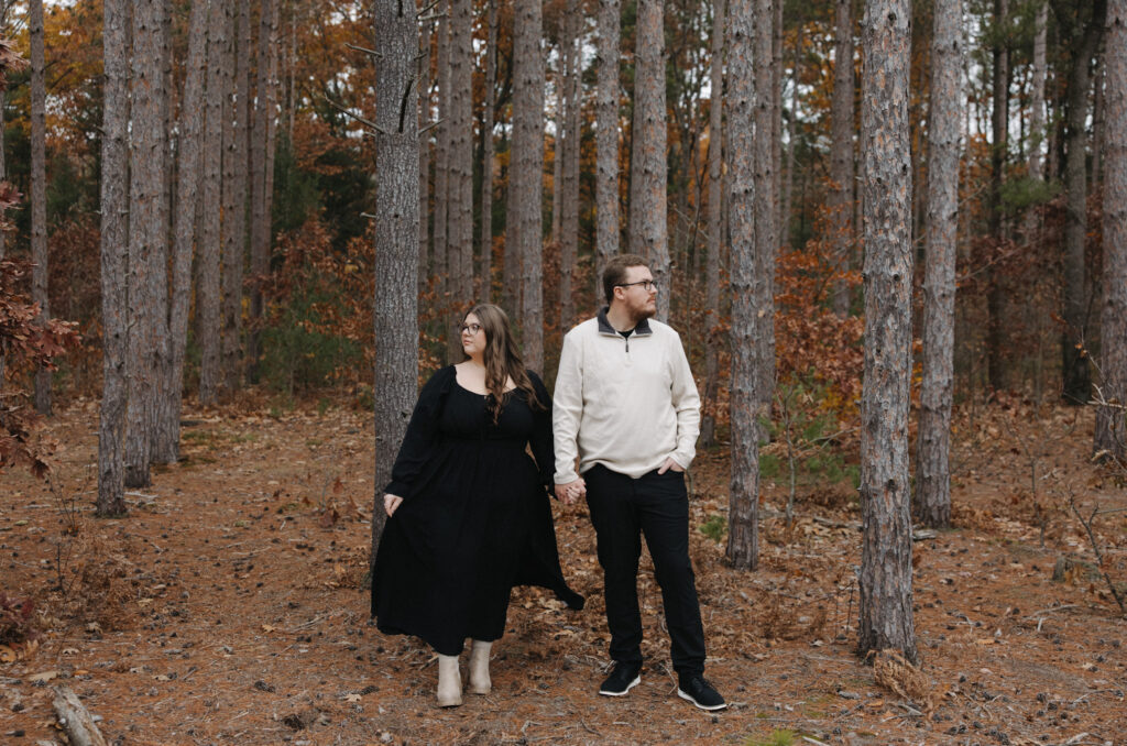 pine tree fall time couple photoshoot black dress 